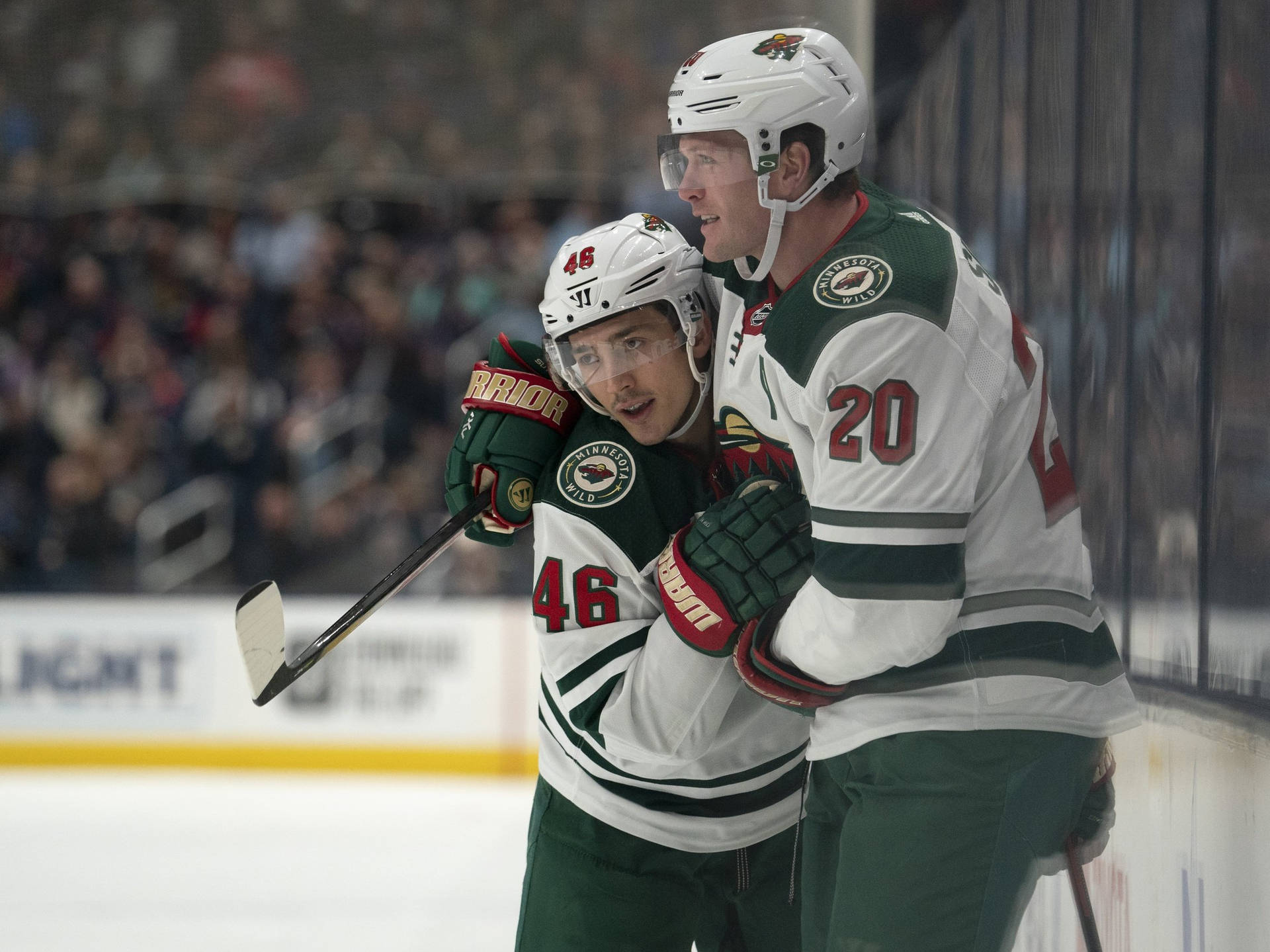 Jared Spurgeon Teammate Hug Bokeh Shot Background