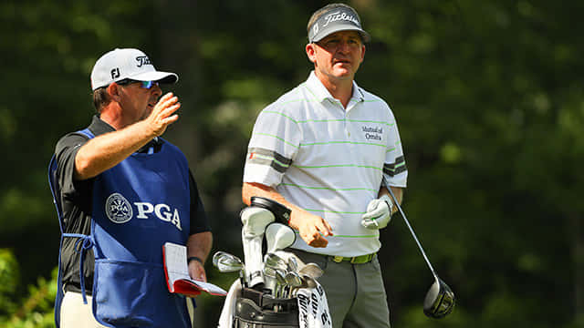 Jason Bohn Confidently Swinging During A Golf Tournament Background
