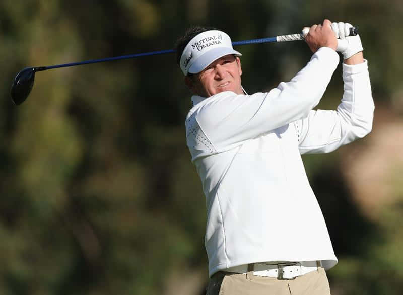 Jason Bohn In Confident Action On The Golf Course Background