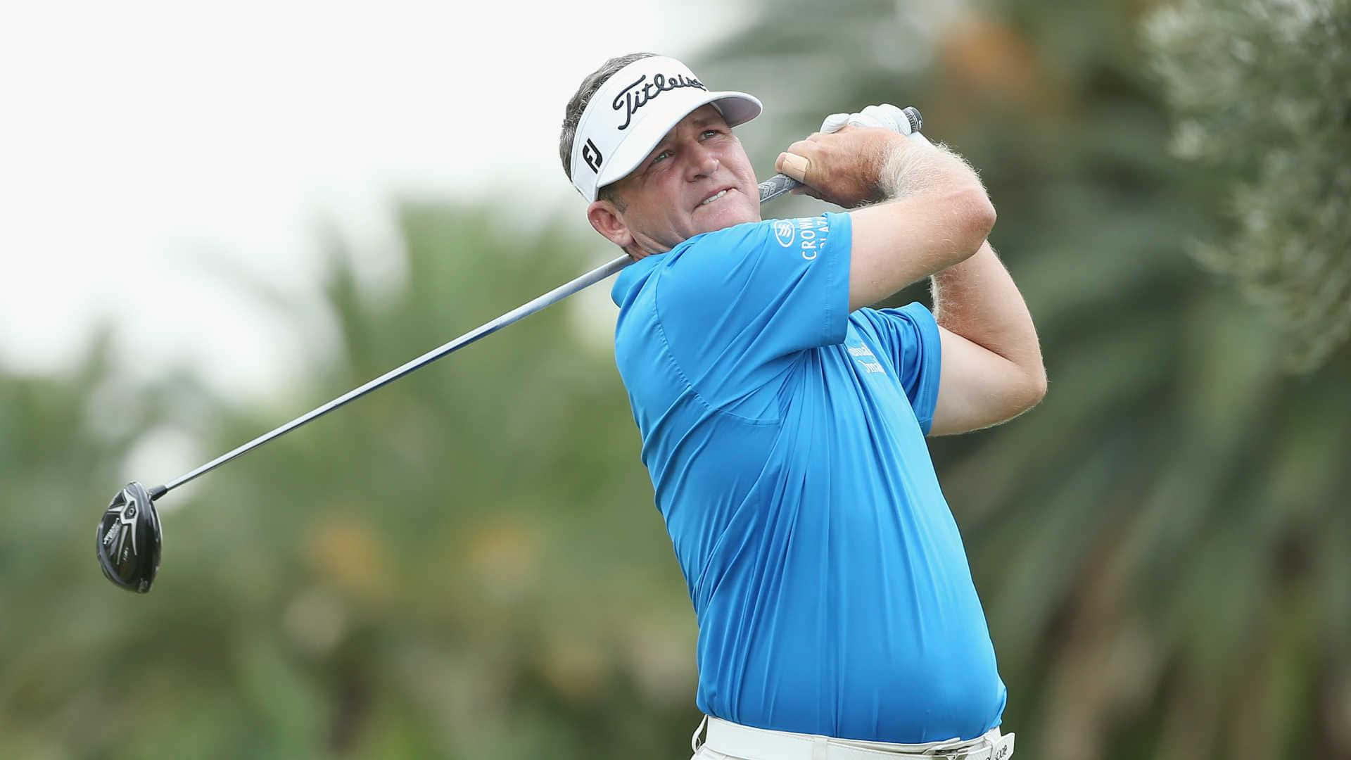 Jason Bohn Intensely Focused During A Golf Game Background