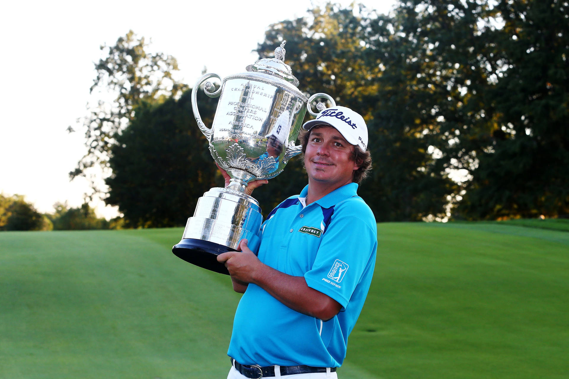 Jason Dufner Carrying His Silver Trophy