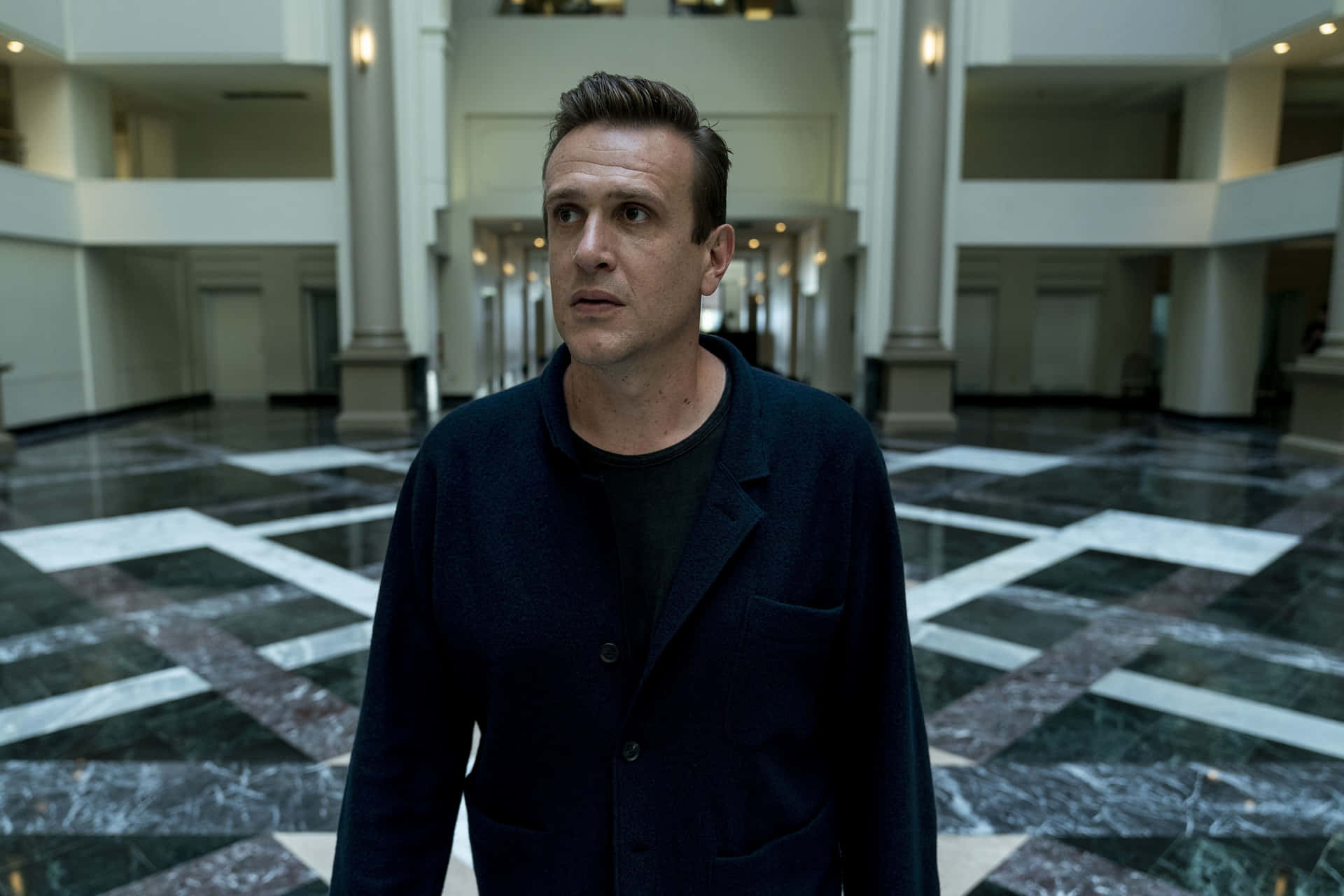 Jason Segel Posing For A Professional Photoshoot Background