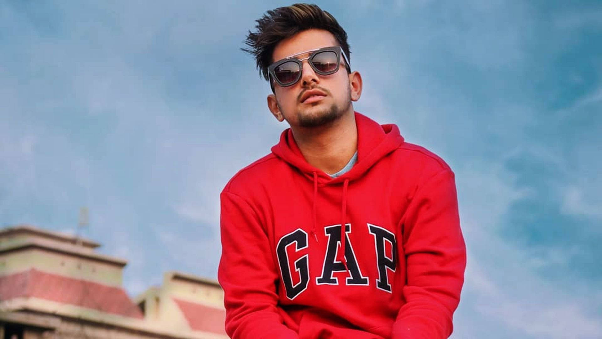 Jass Manak In Red Hoodie Background