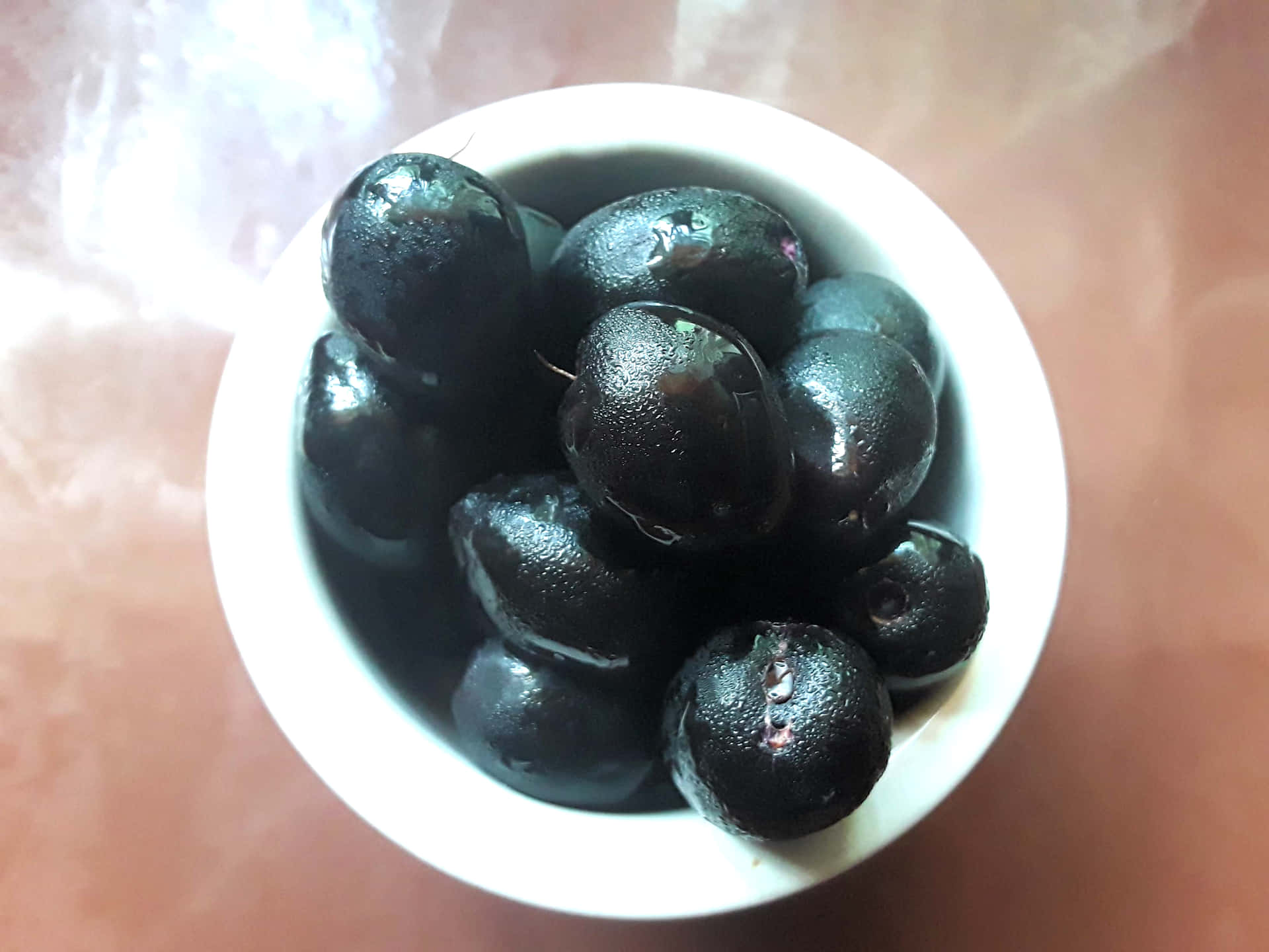 Java Plums Glossy Wooden Table Background