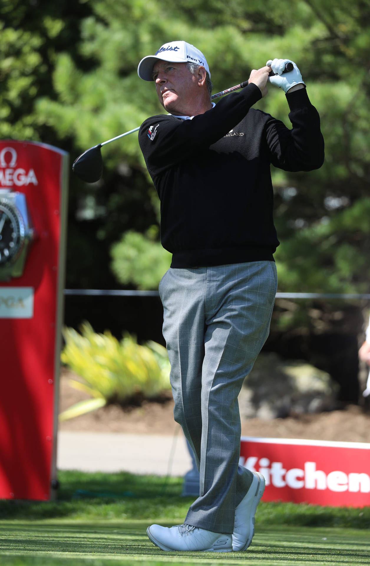 Jay Haas In Mid Swing During Golf Tournament Background