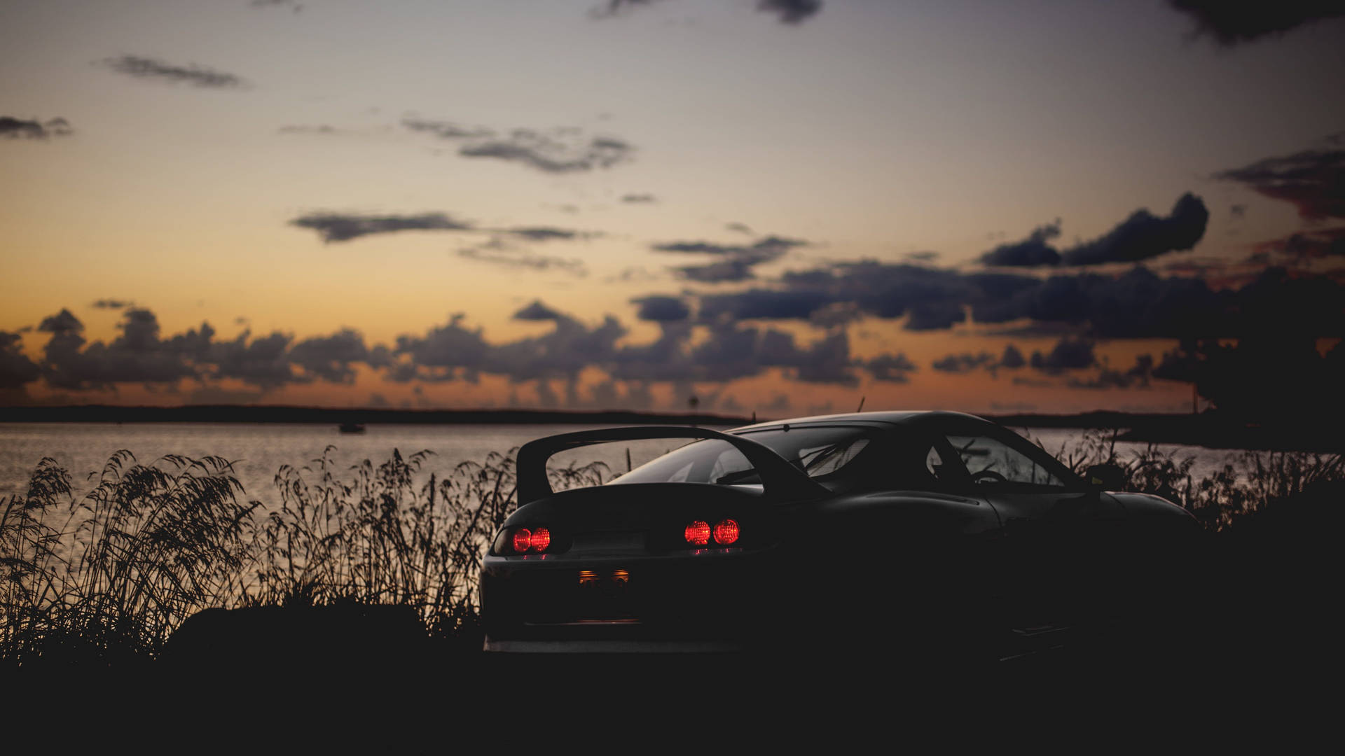 Jdm Car Near Sea After Sunset Background