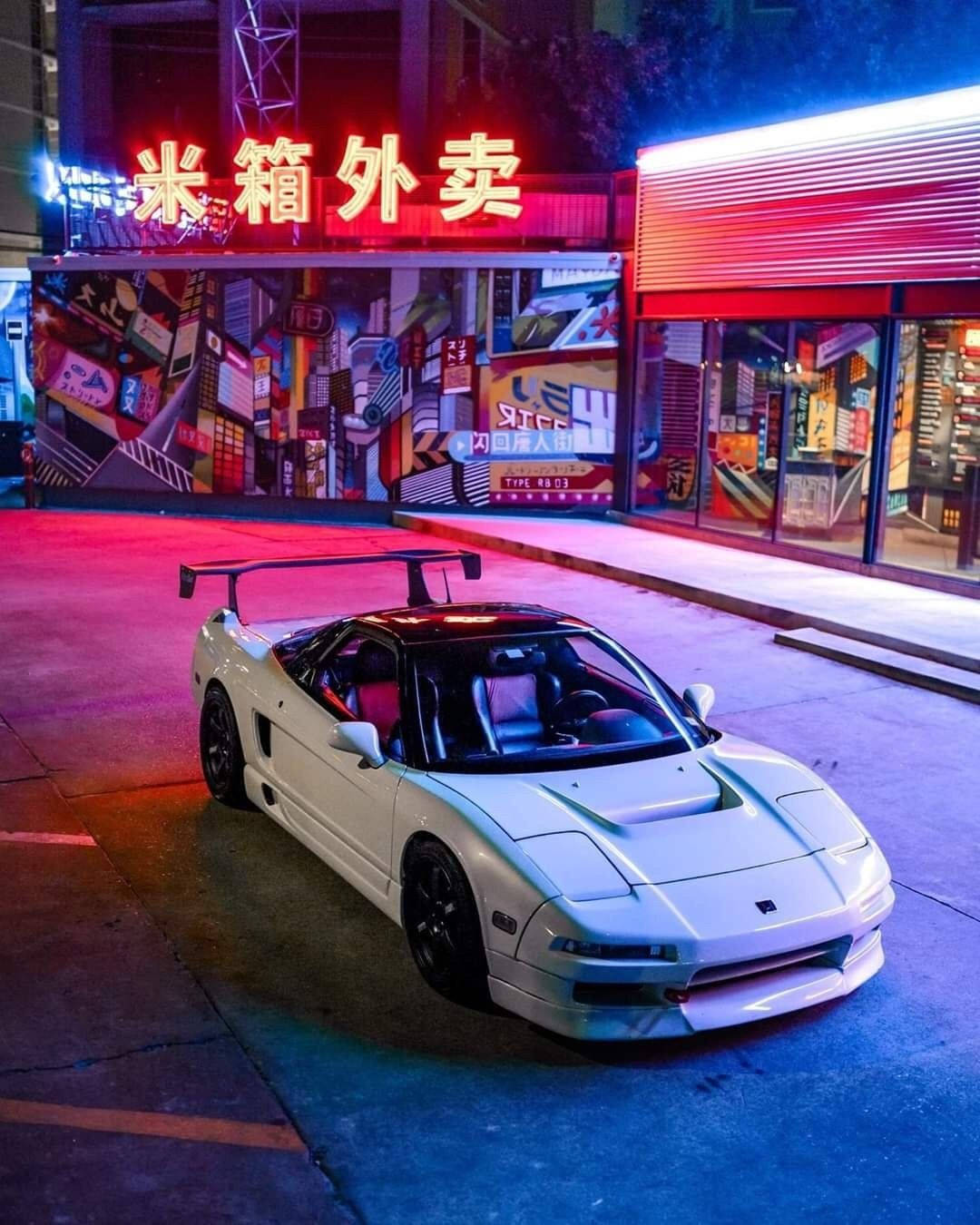 Jdm Car Surrounded By Neon Lights Background