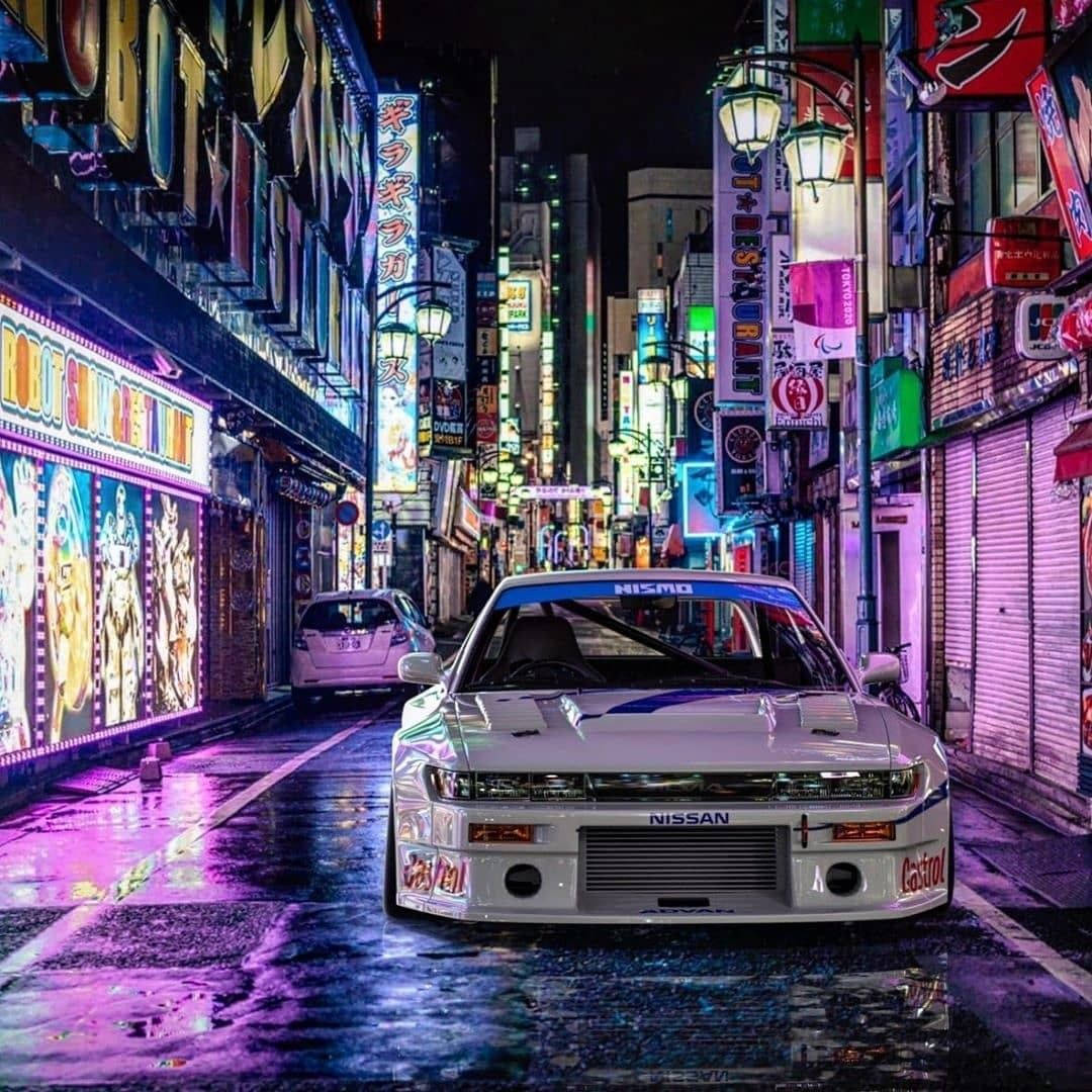 Jdm Cars On Colorful Side Street Background