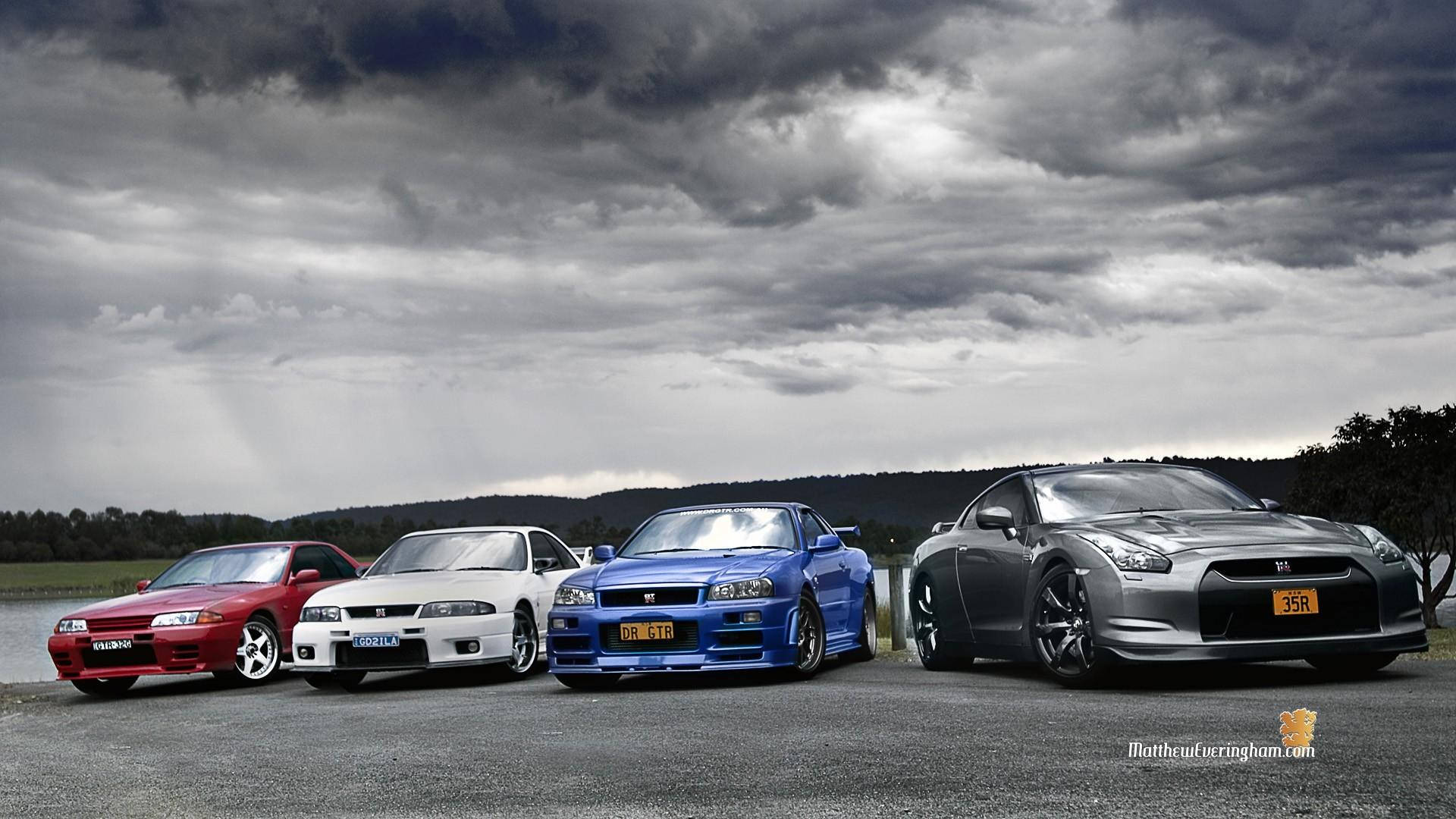 Jdm Cars Under Cloudy Sky Background