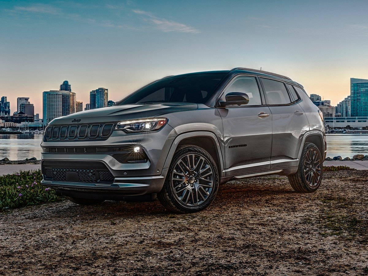 Jeep Compass On Dirt During Sunset Background