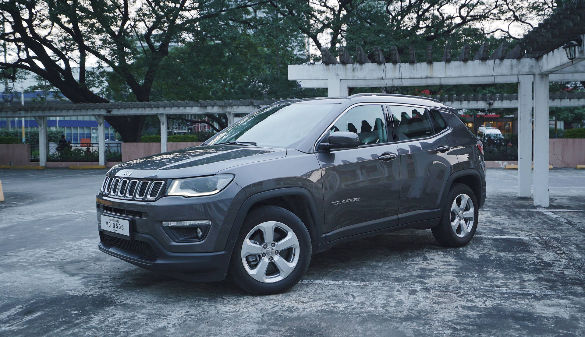 Jeep Compass On Gray Concrete Floor Background