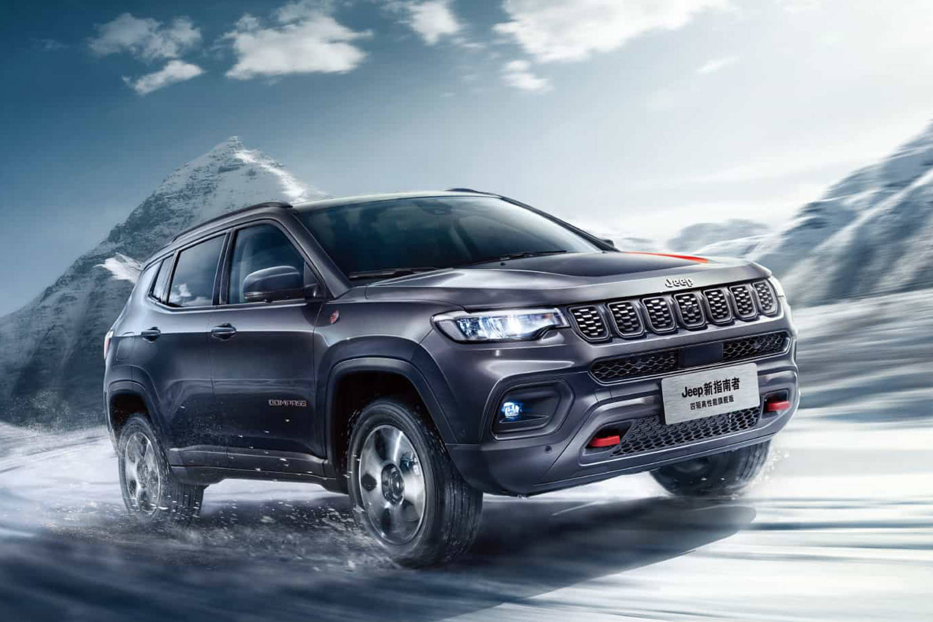 Jeep Compass On Snow With Mountains Background