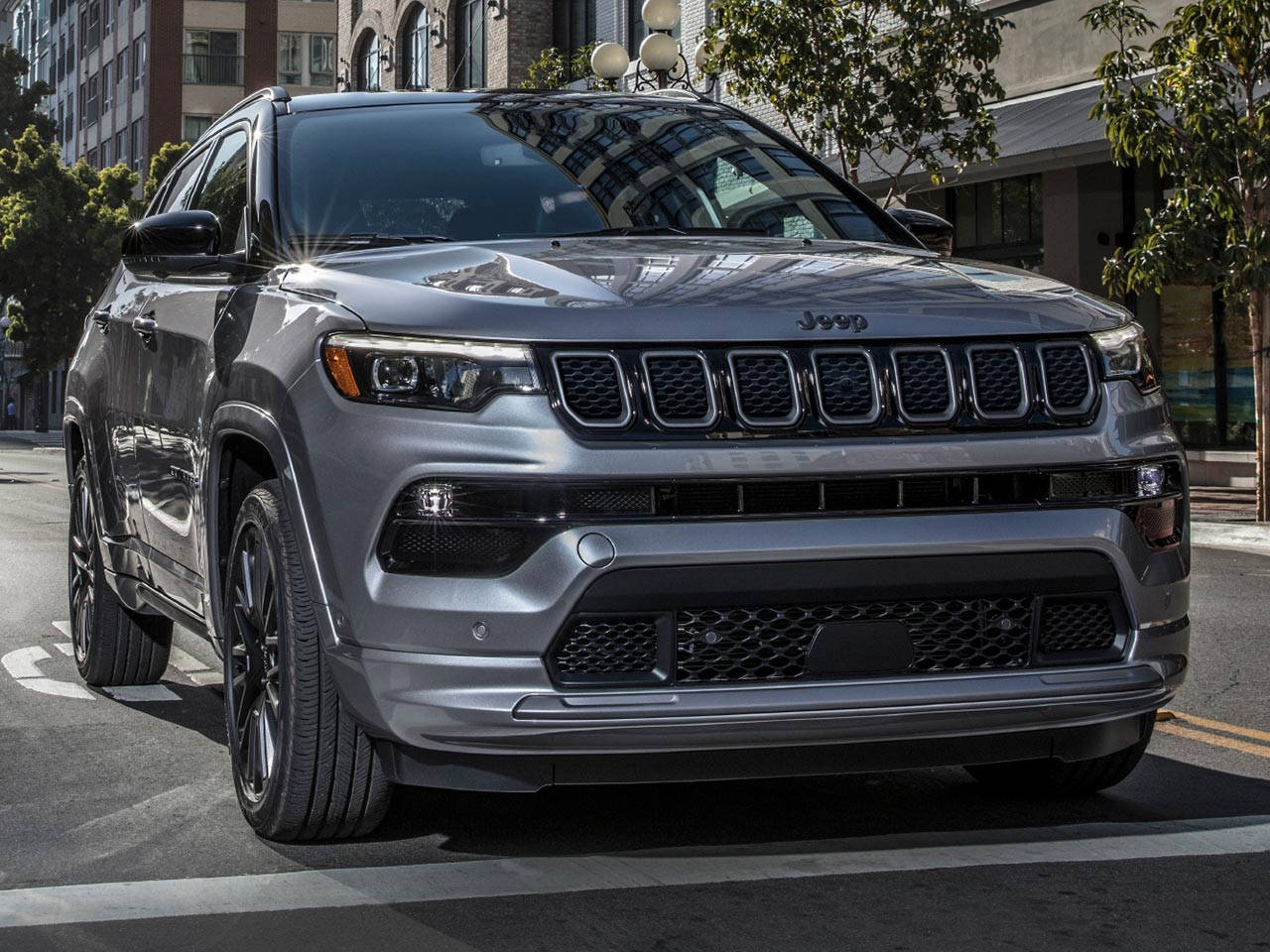 Jeep Compass Silver On Road Front View Background