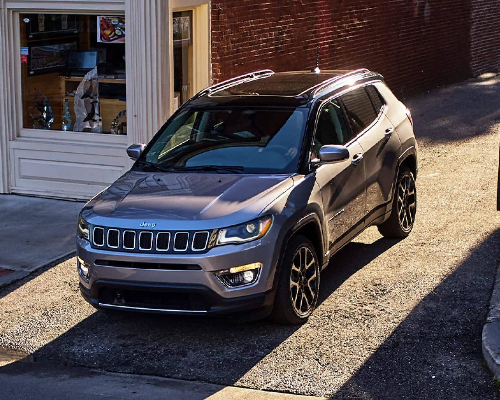 Jeep Compass Sunlight On Road Background