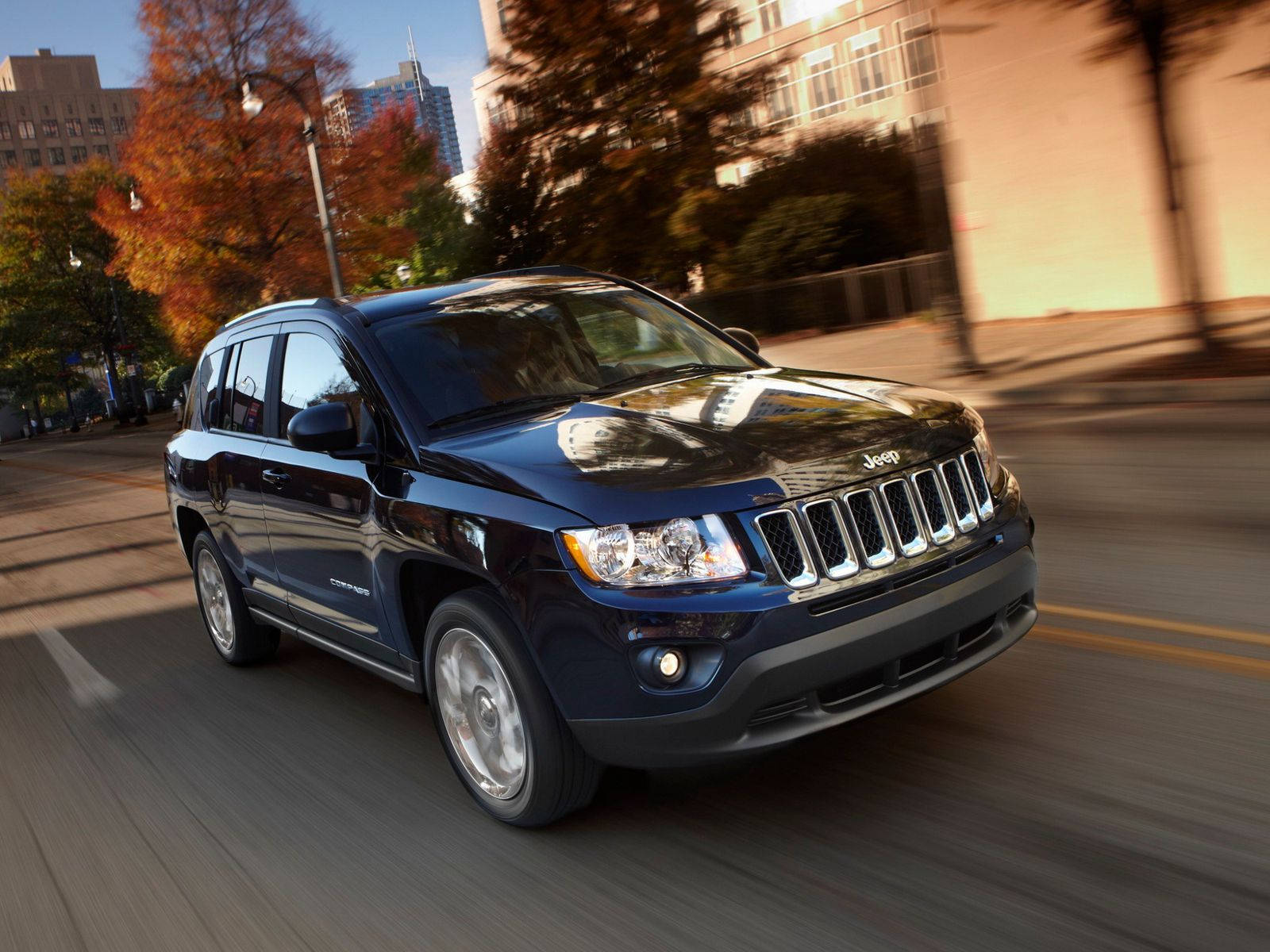 Jeep Compass Zooming On Road Background