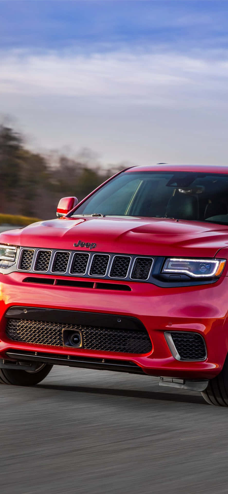 Jeep Trackhawk Under Clear Sky Background