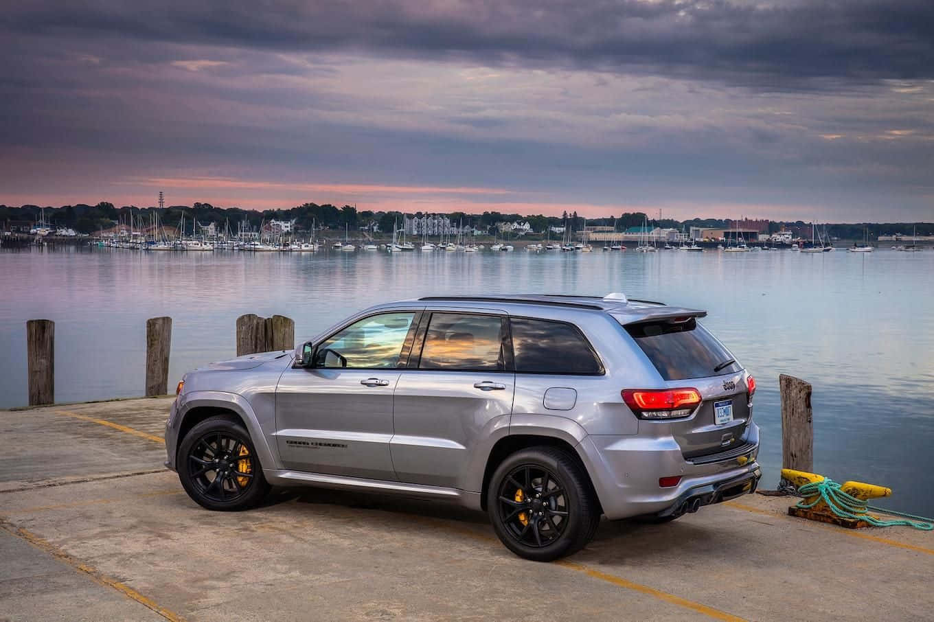 Jeep Trackhawk Under Clouds Background