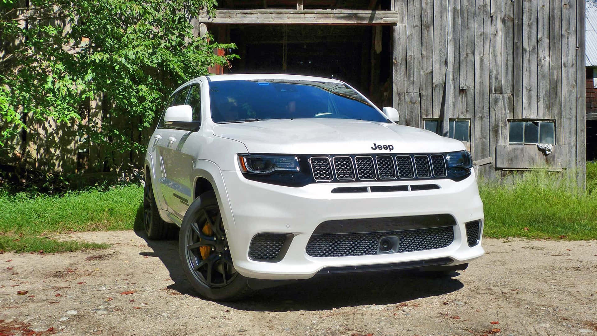 Jeep Trackhawk With Shrubs Background