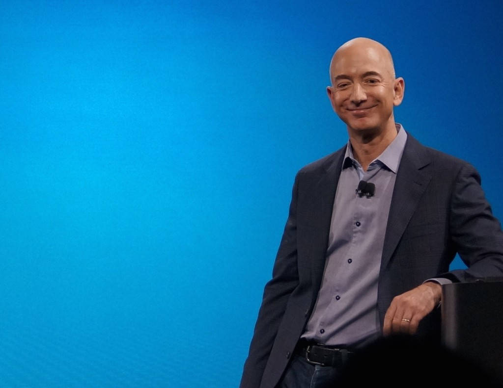 Jeff Bezos Leaning Blue Background Background