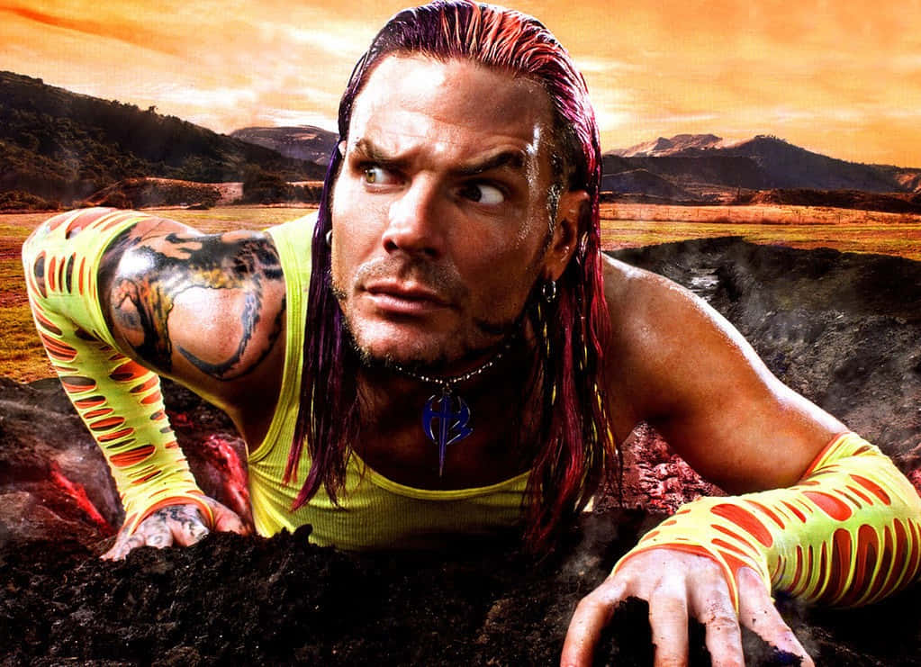 Jeff Hardy Climbing Up From Volcano Background