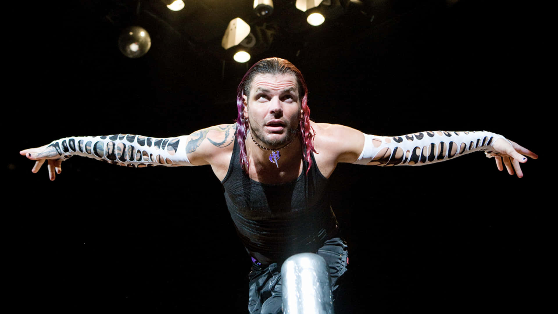 Jeff Hardy Kneeling As He Bows Elegantly Background