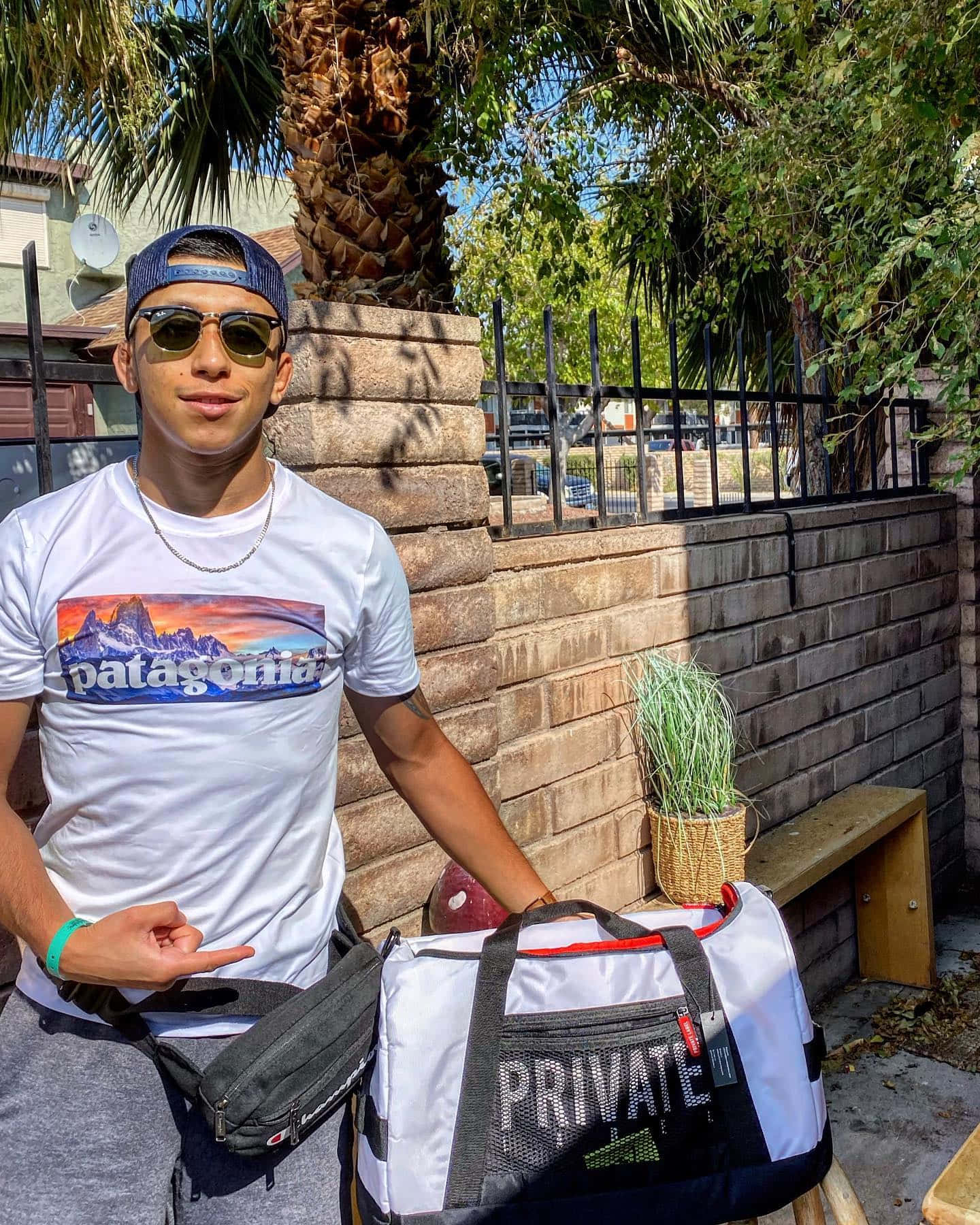 Jeff Molina Pointing At Bag Background
