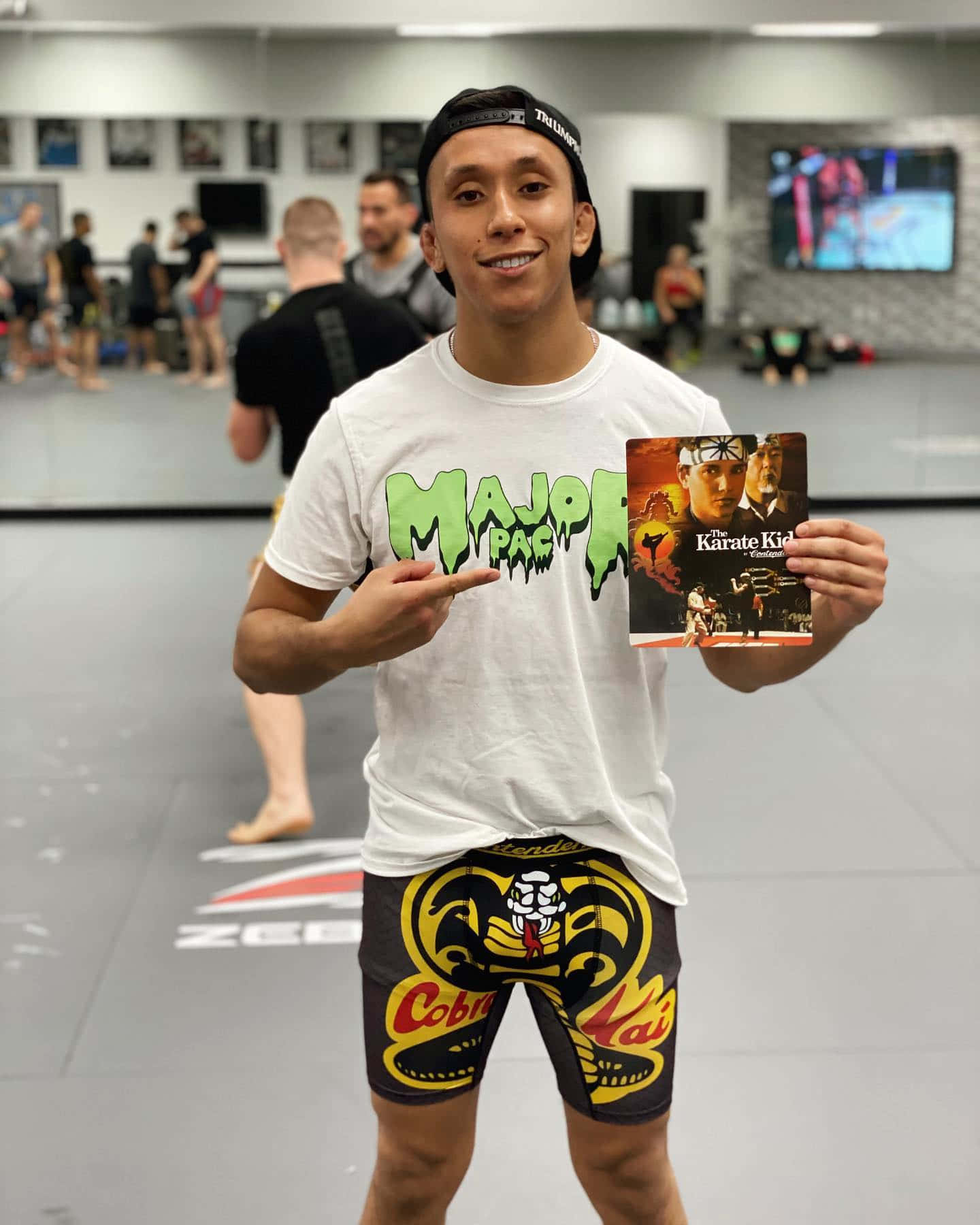 Jeff Molina Pointing At Karate Kid Poster Background