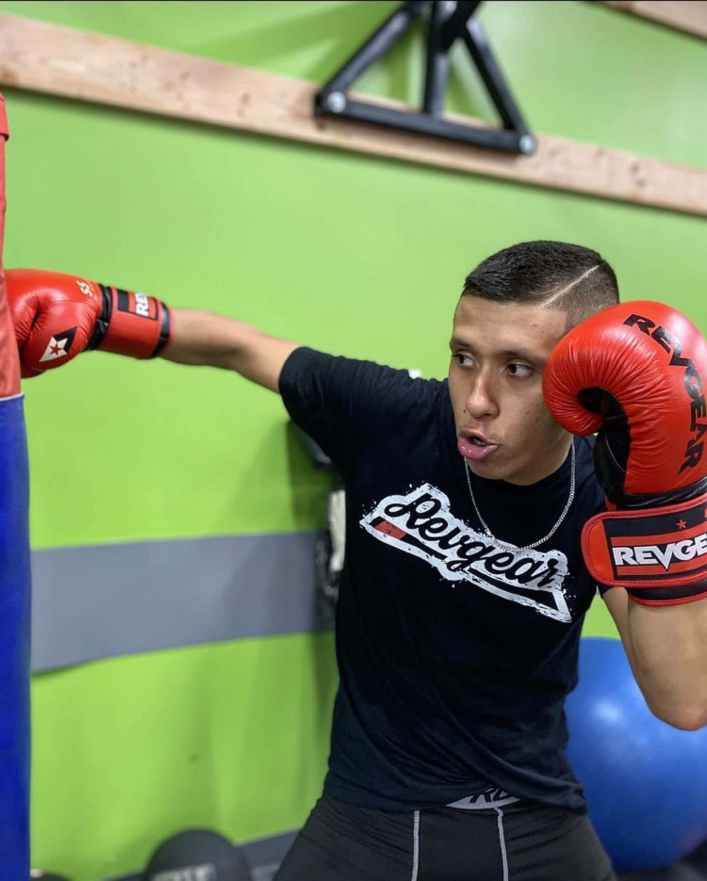 Jeff Molina With A Punching Bag Background