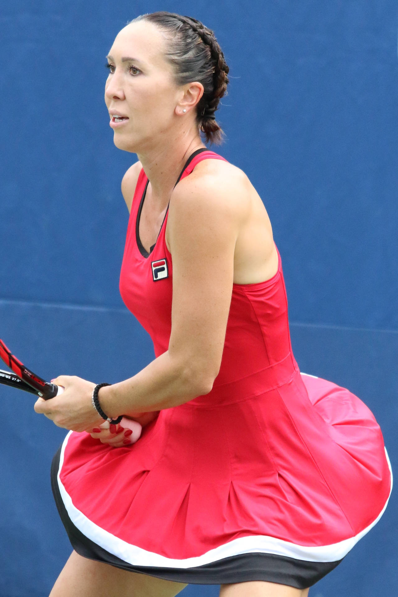 Jelena Jankovic In A Red Fila Dress On The Tennis Court Background