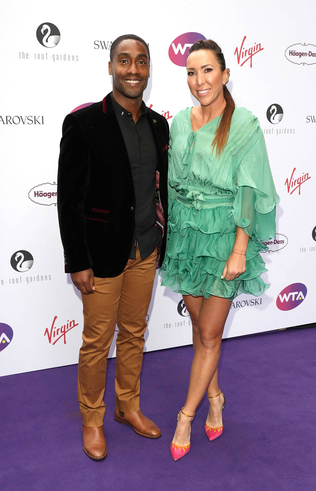 Jelena Jankovic With Simon Webbe At An Event. Background