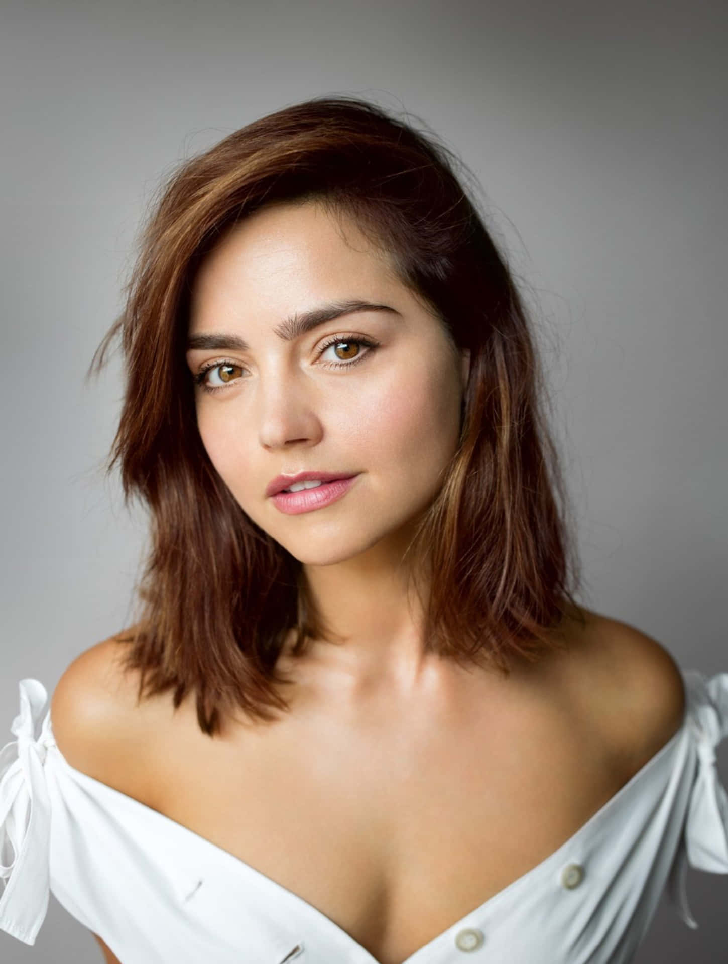 Jenna Coleman Poses Elegantly Against A Simple Backdrop