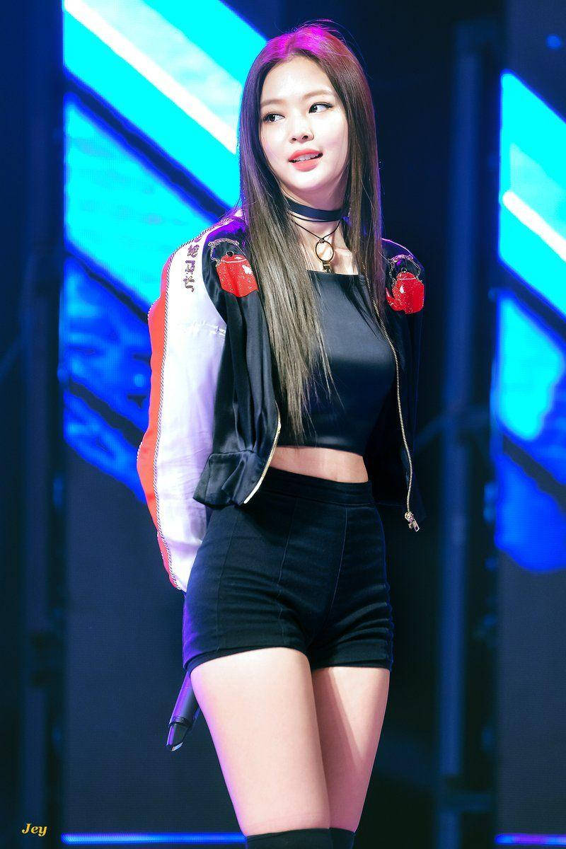 Jennie Kim Standing On Stage Background