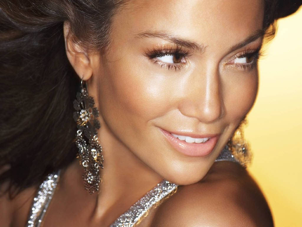 Jennifer Lopez Glowing In A Beautiful Sterling Dress Background