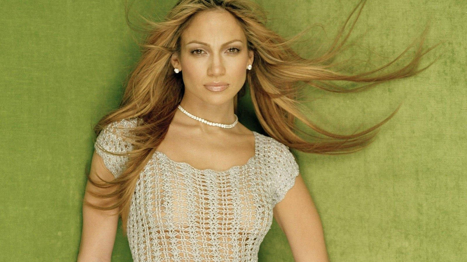 Jennifer Lopez Looking Radiant In A See-through Top Background