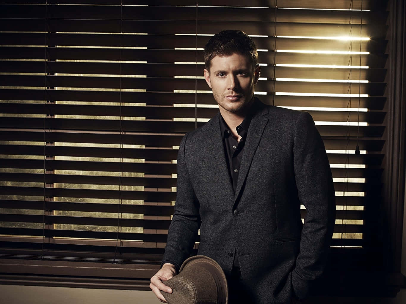 Jensen Ackles In A Dark Style In Men Suit Background