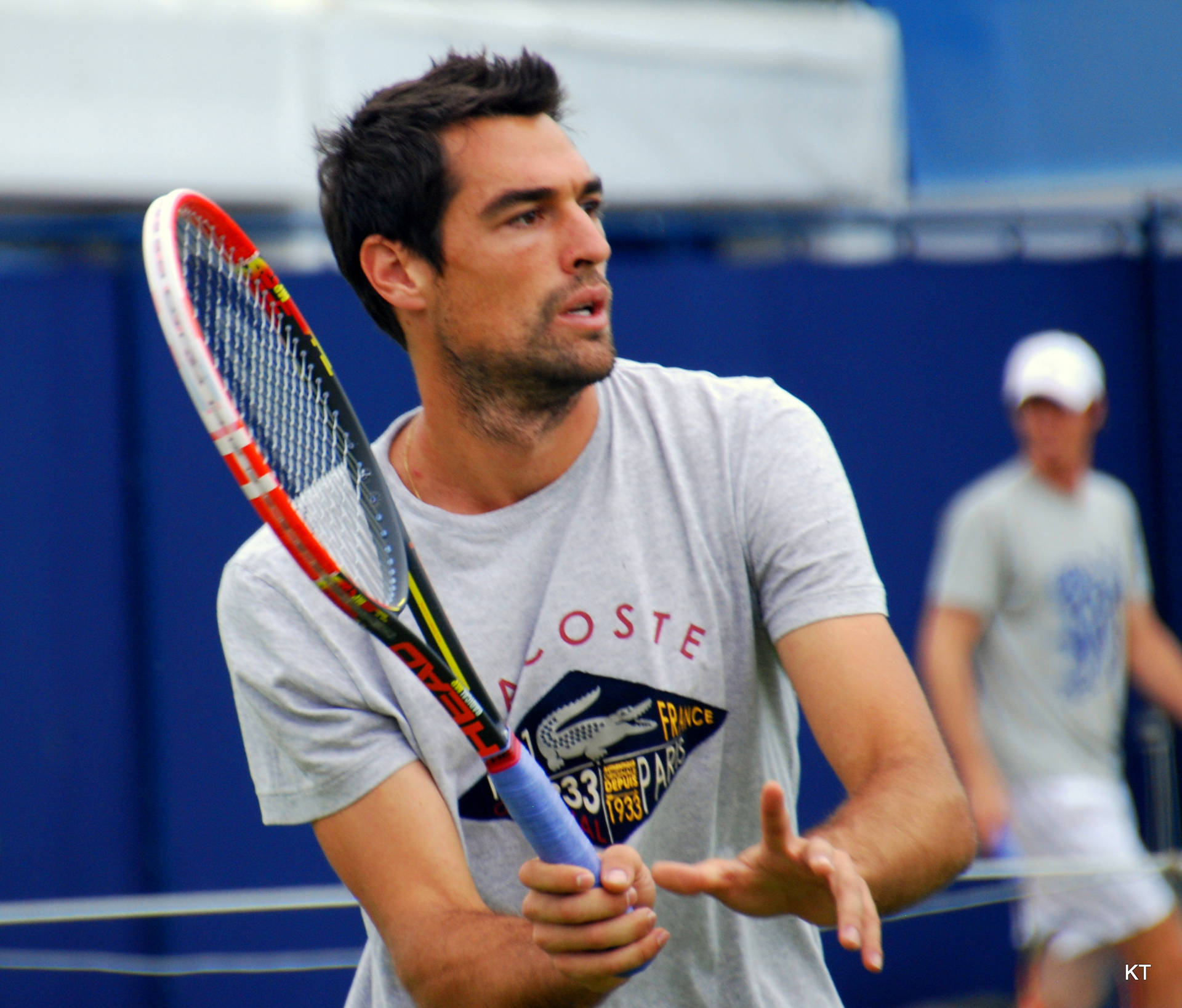 Jeremy Chardy In Action With Tennis Racket Background