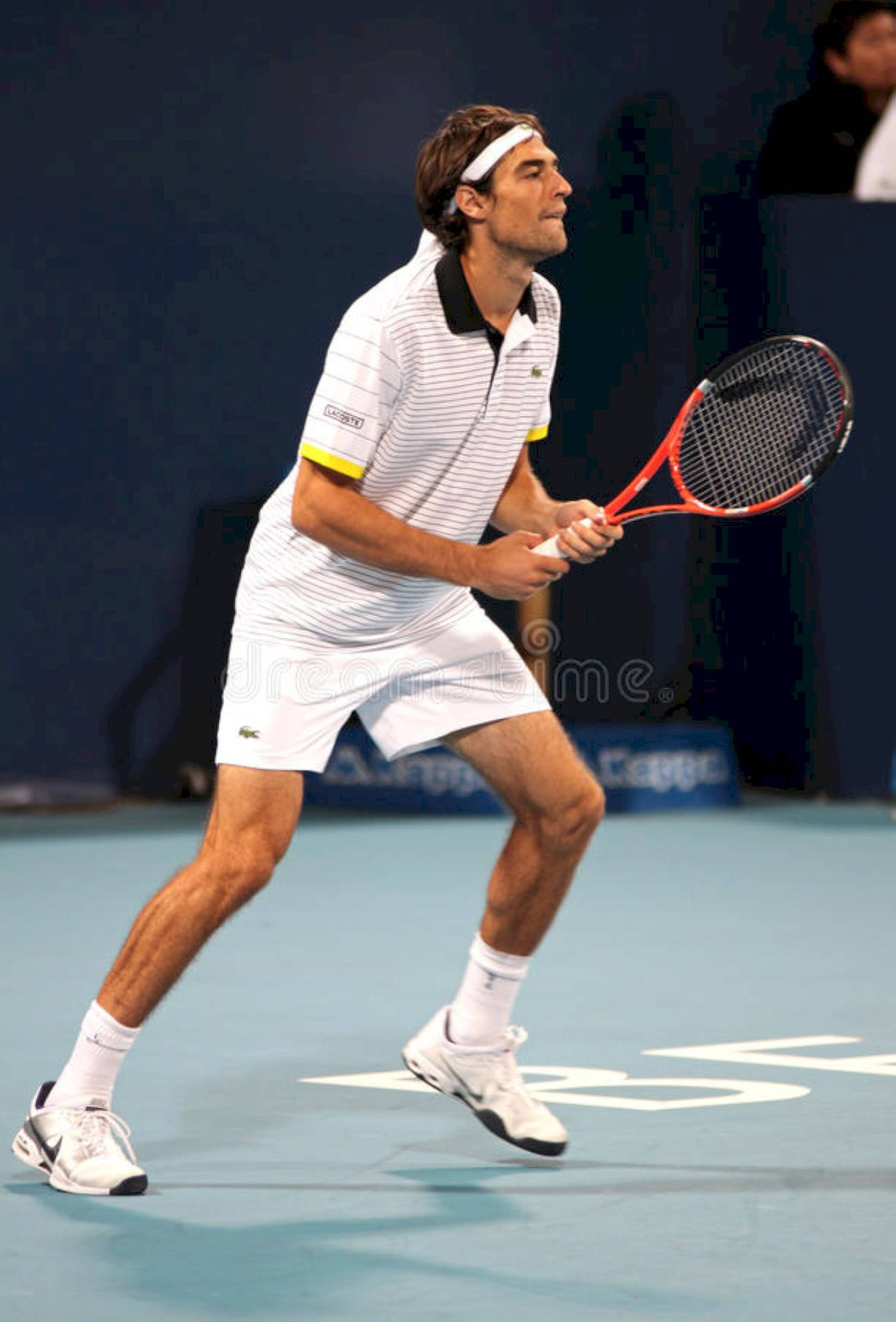 Jeremy Chardy Playing A Powerful Forehand In A Professional Tennis Match Background