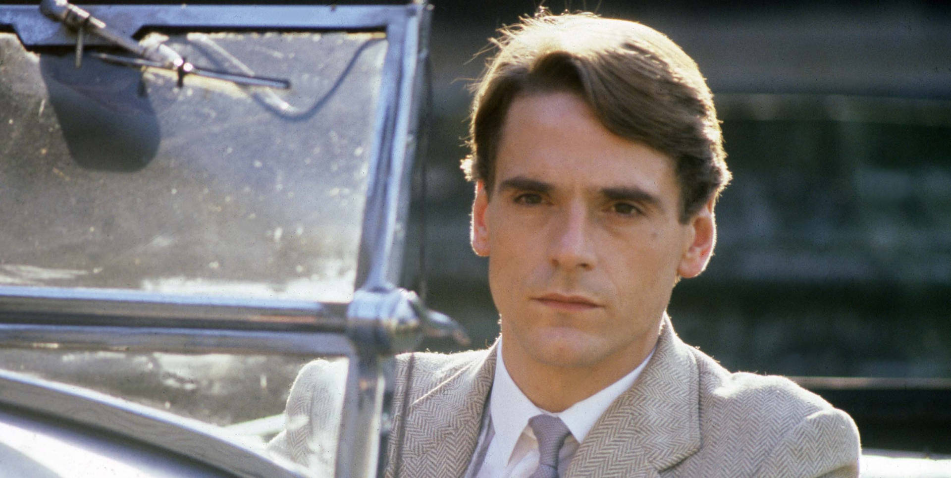 Jeremy Irons In A Riveting Scene From Munich Film Background