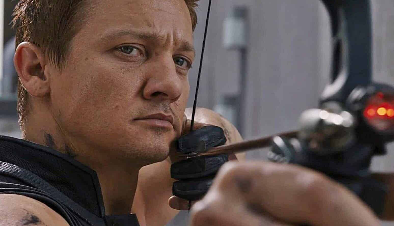 Jeremy Renner Aiming With A Bow Background