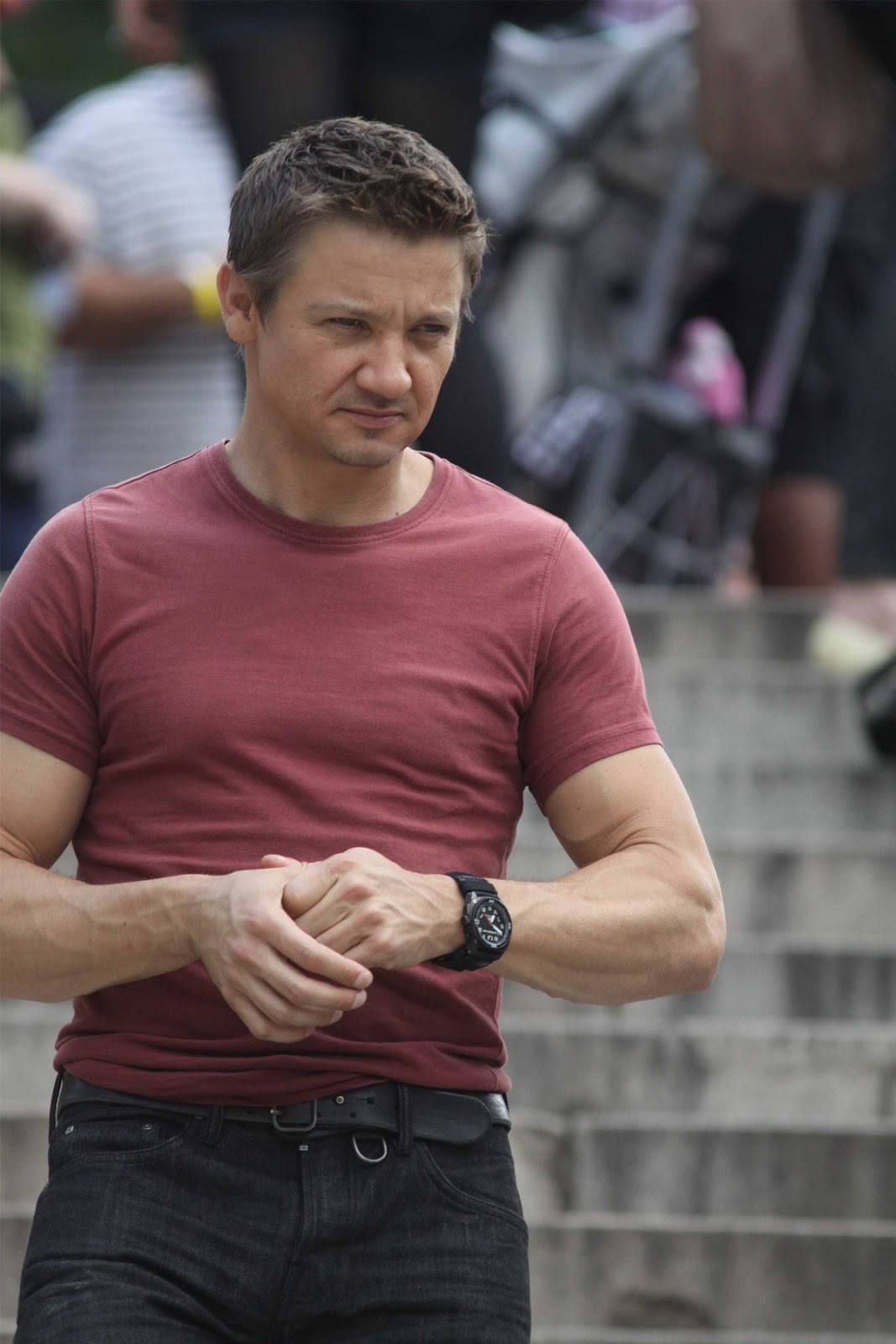 Jeremy Renner In Red Fit Shirt Background