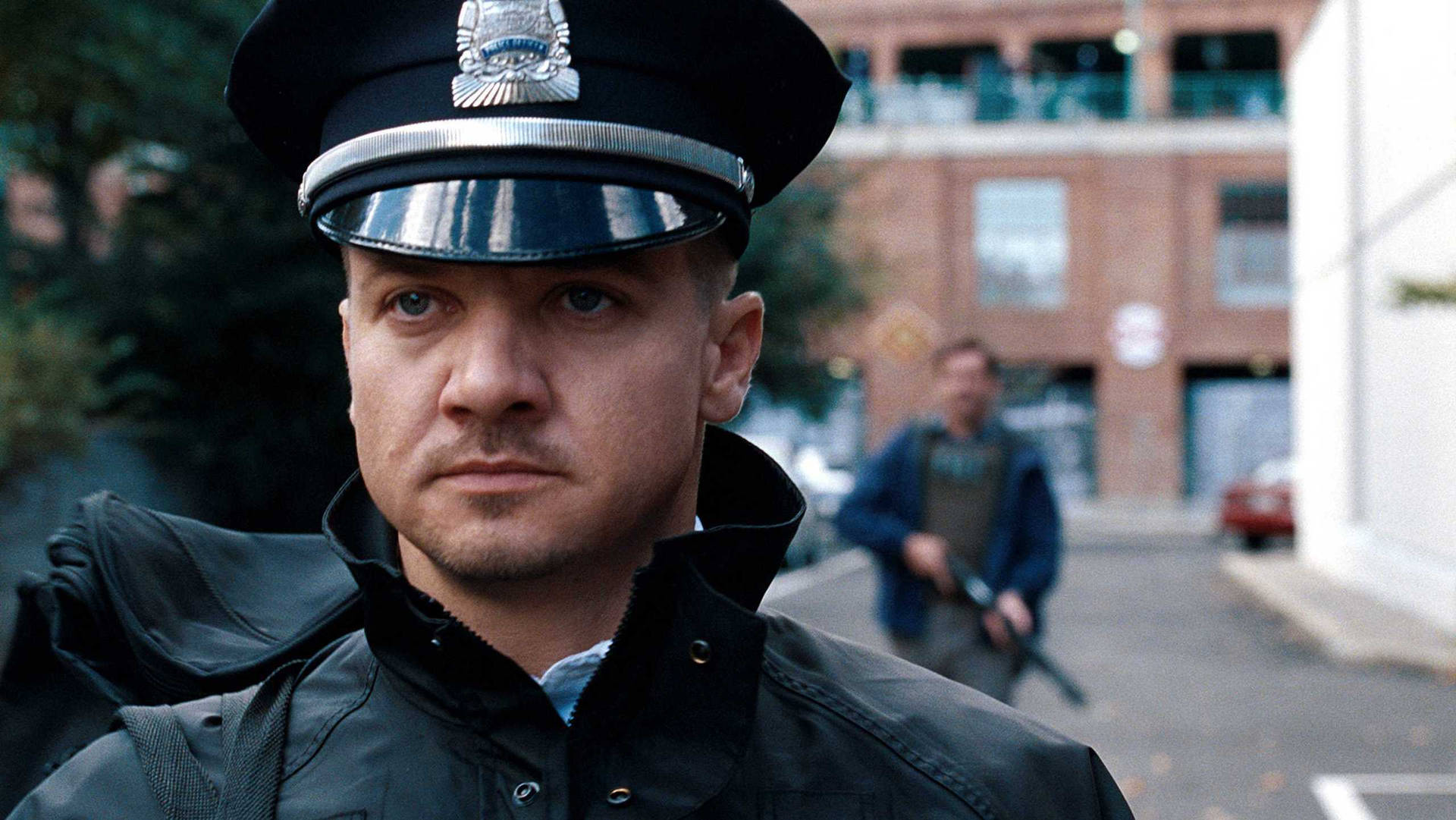 Jeremy Renner Portrays A Police Officer Background