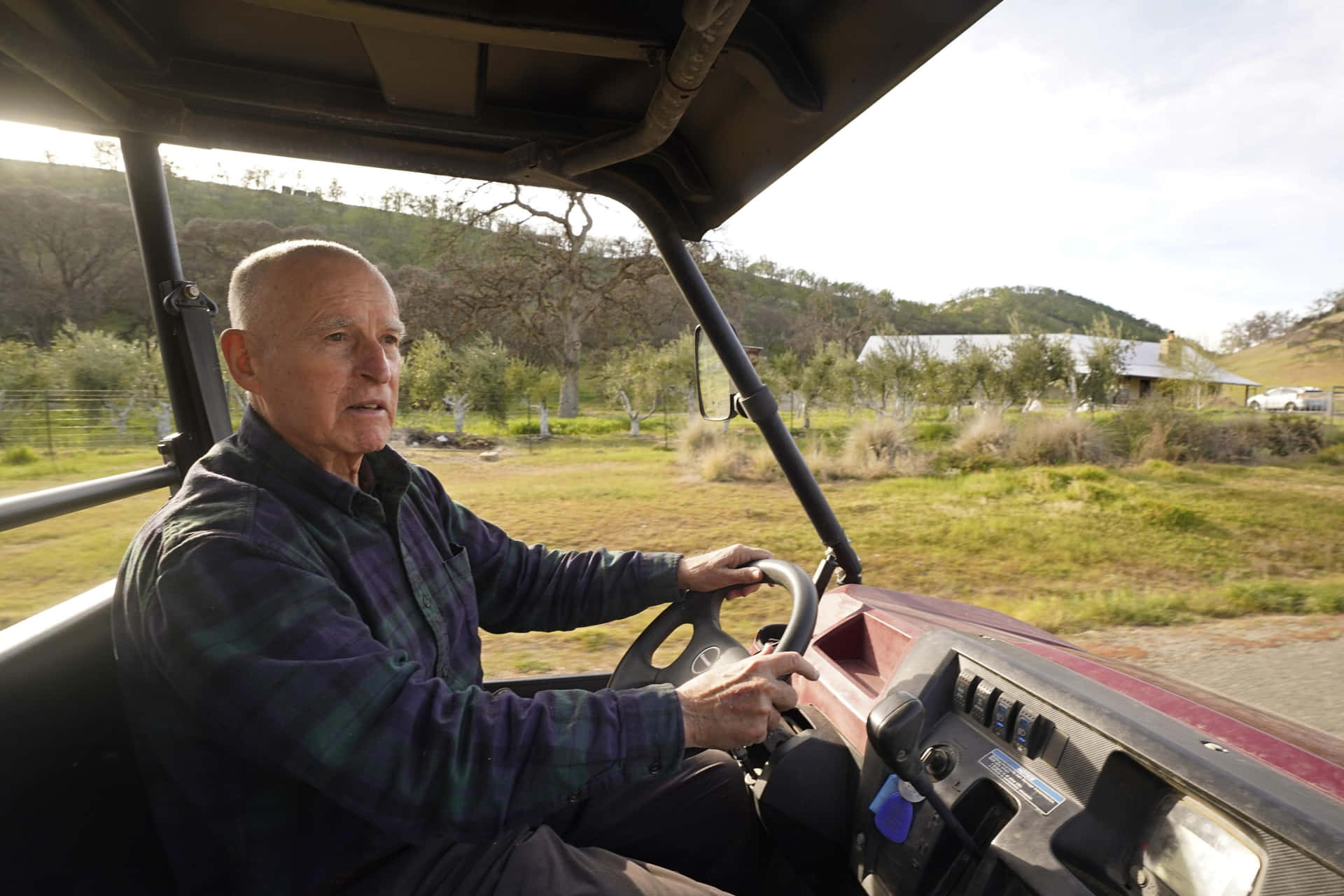 Jerry Brown Drives All-terrain Vehicle Background