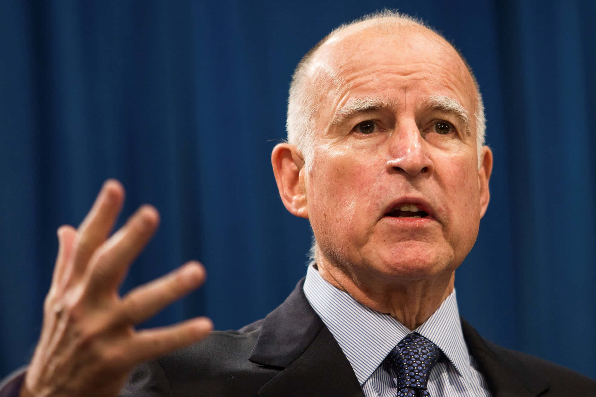Jerry Brown Speaking Passionately In California Background