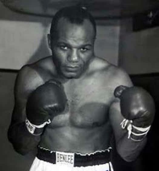 Jersey Joe Walcott' Half Body Southpaw Fists Background