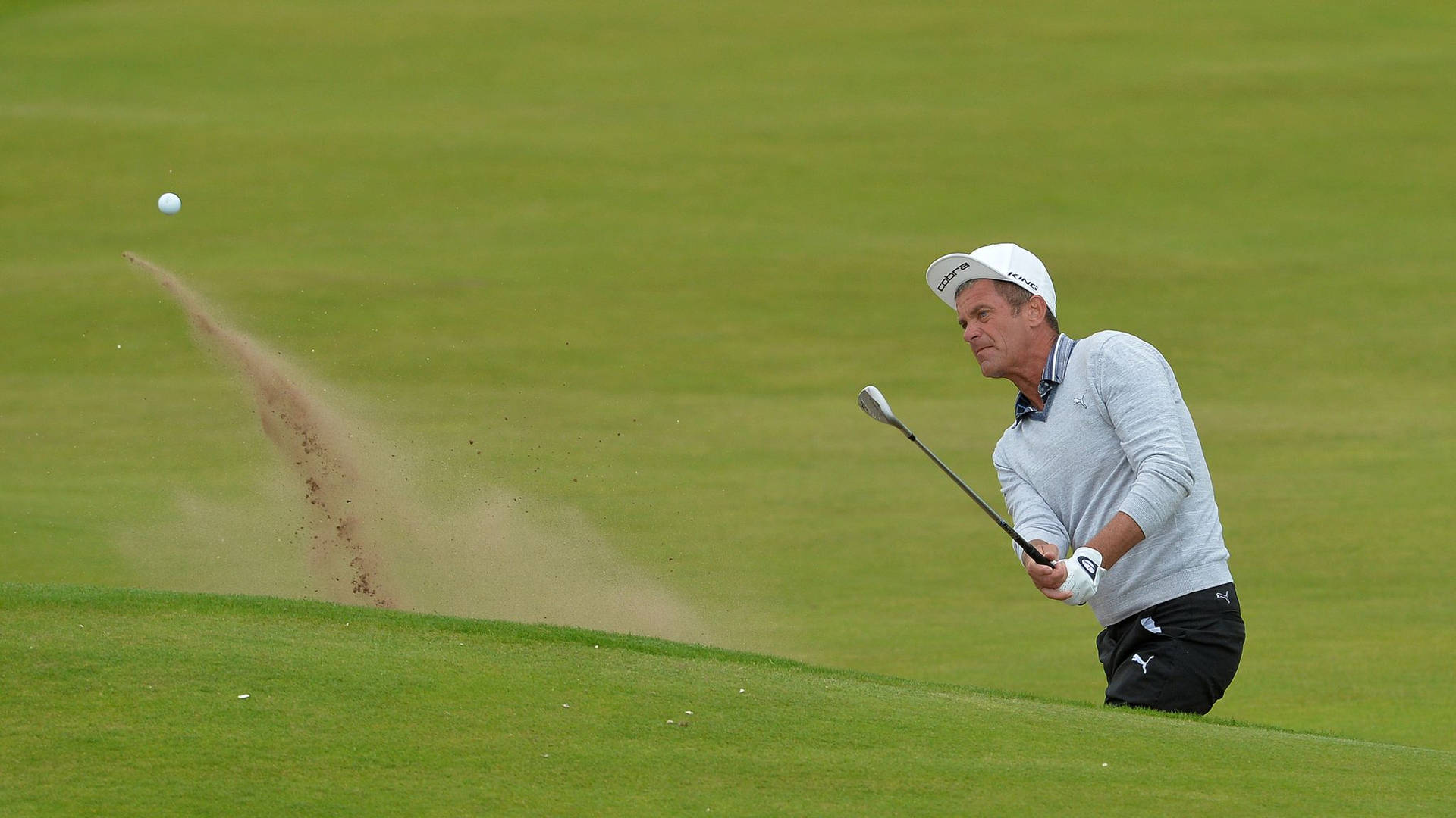 Jesper Parnevik Hitting Golf Ball Background