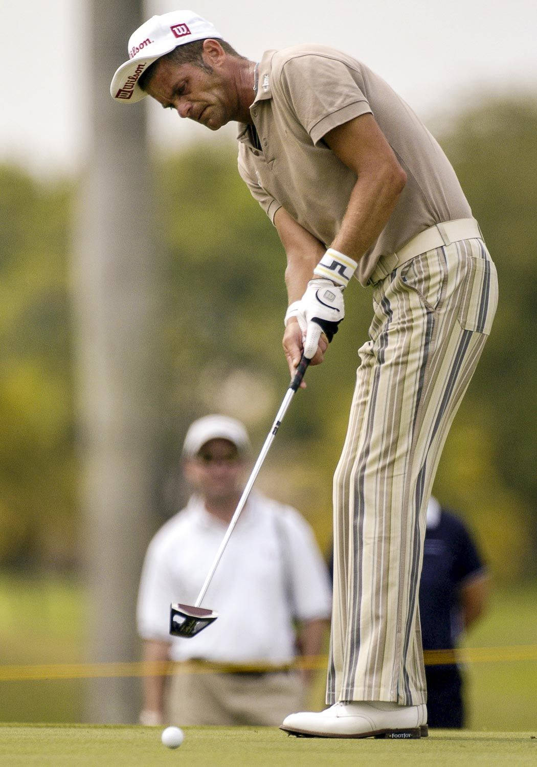 Jesper Parnevik In Brown Golf Attire Background