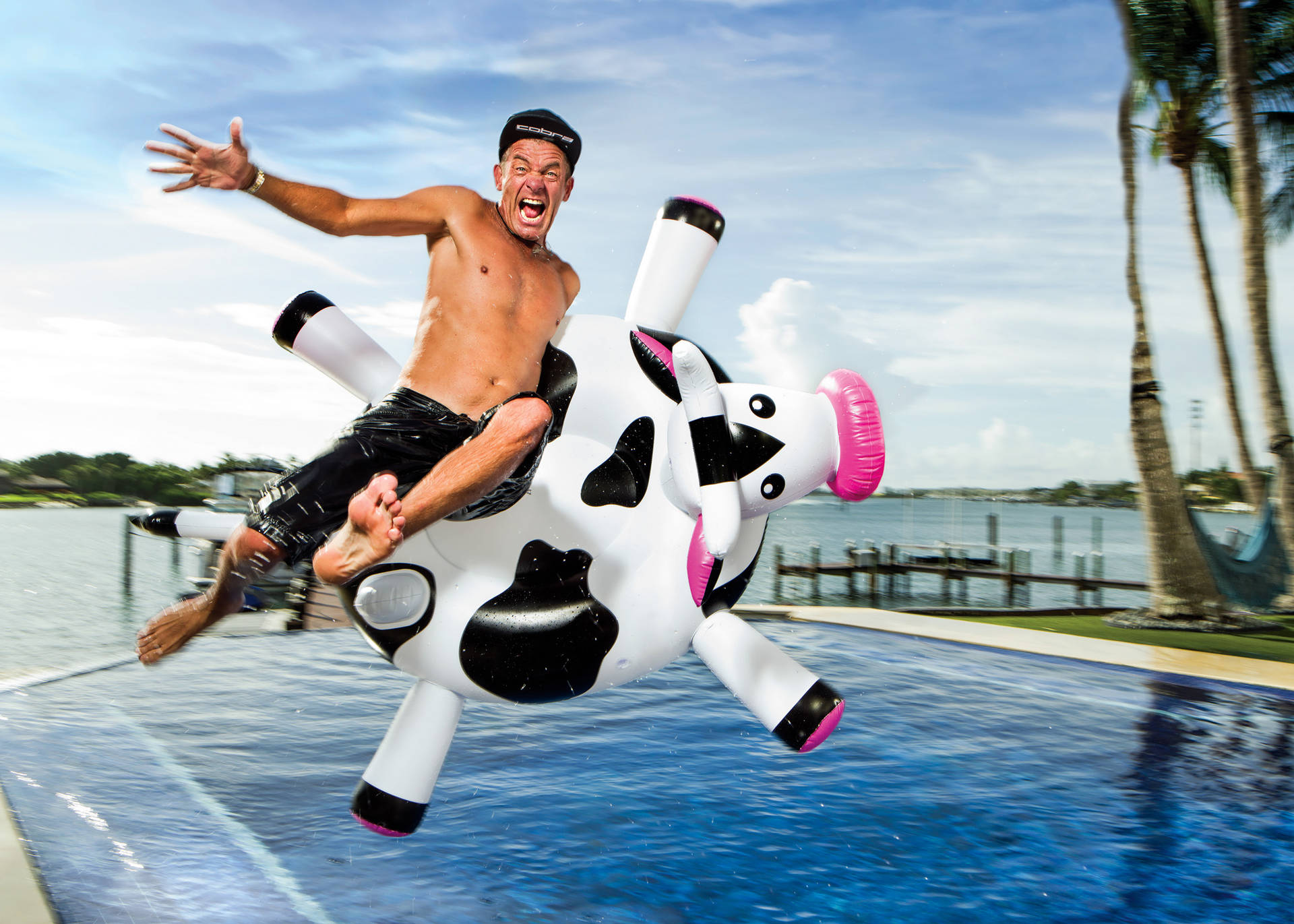 Jesper Parnevik Jumping Into Pool Background