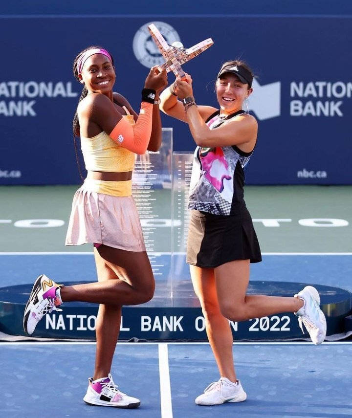 Jessica Pegula And Coco Gauff Posing After A Thrilling Tennis Match. Background