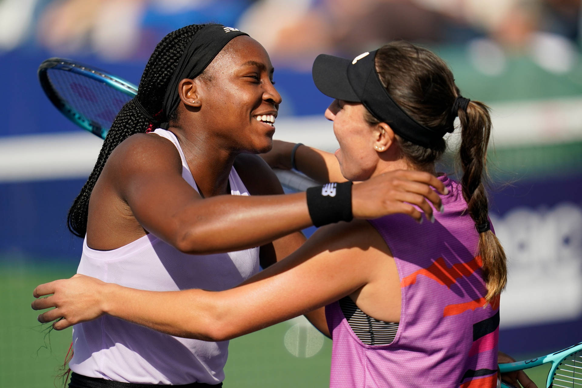 Jessica Pegula Embracing Coco Gauff After A Match Background