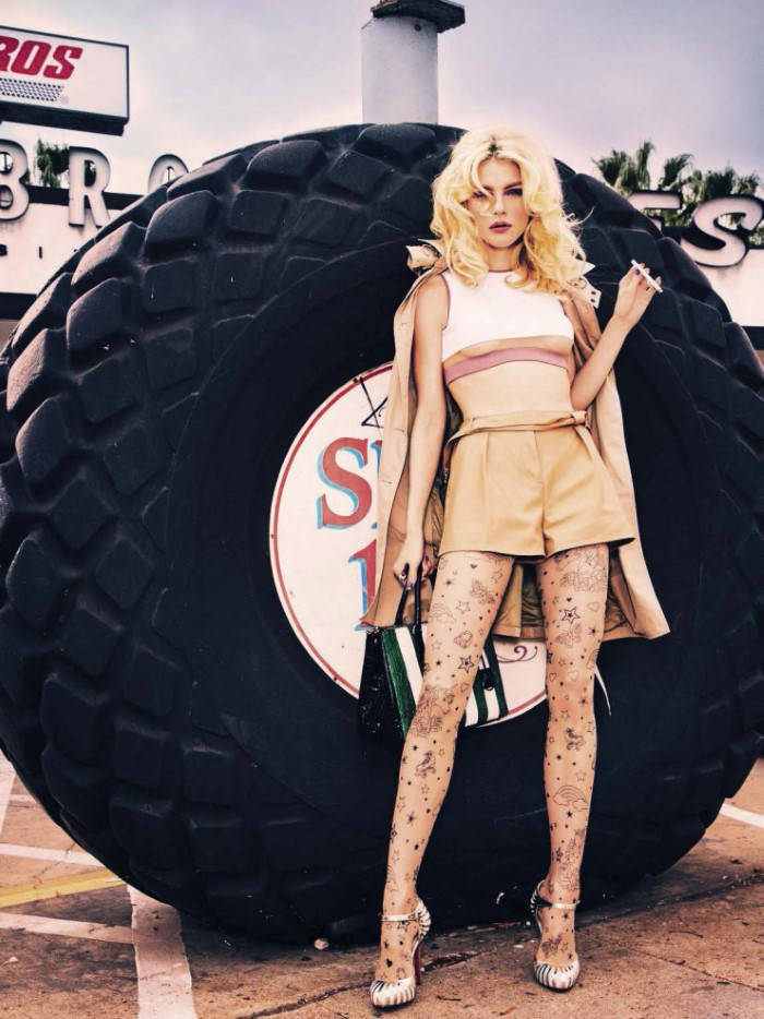 Jessica Stam Posing With Huge Tire Background